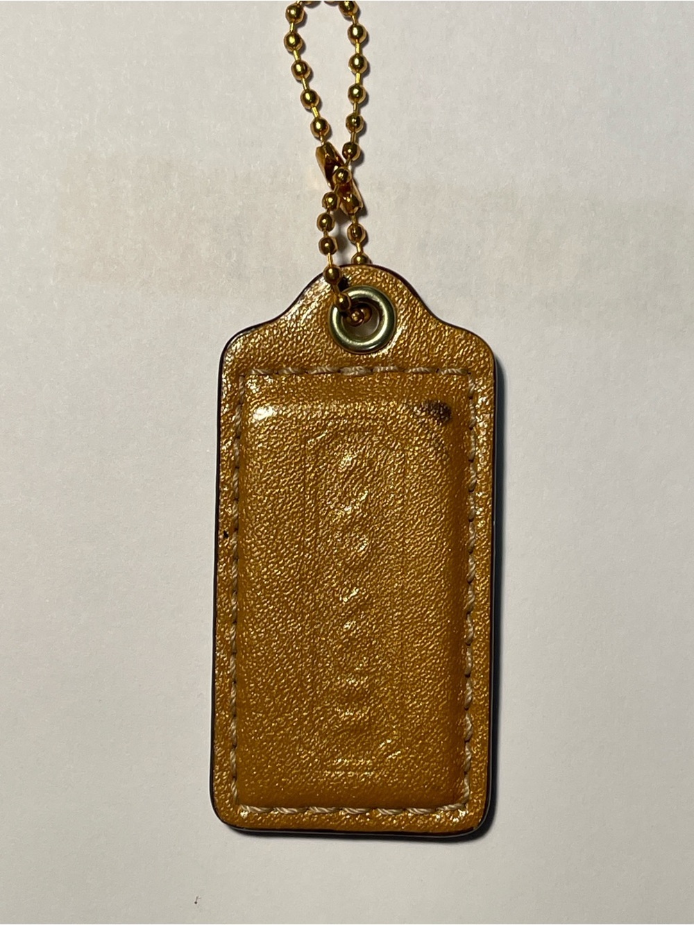 Coach Patent Leather Hang Tag in Pearlized Mustard